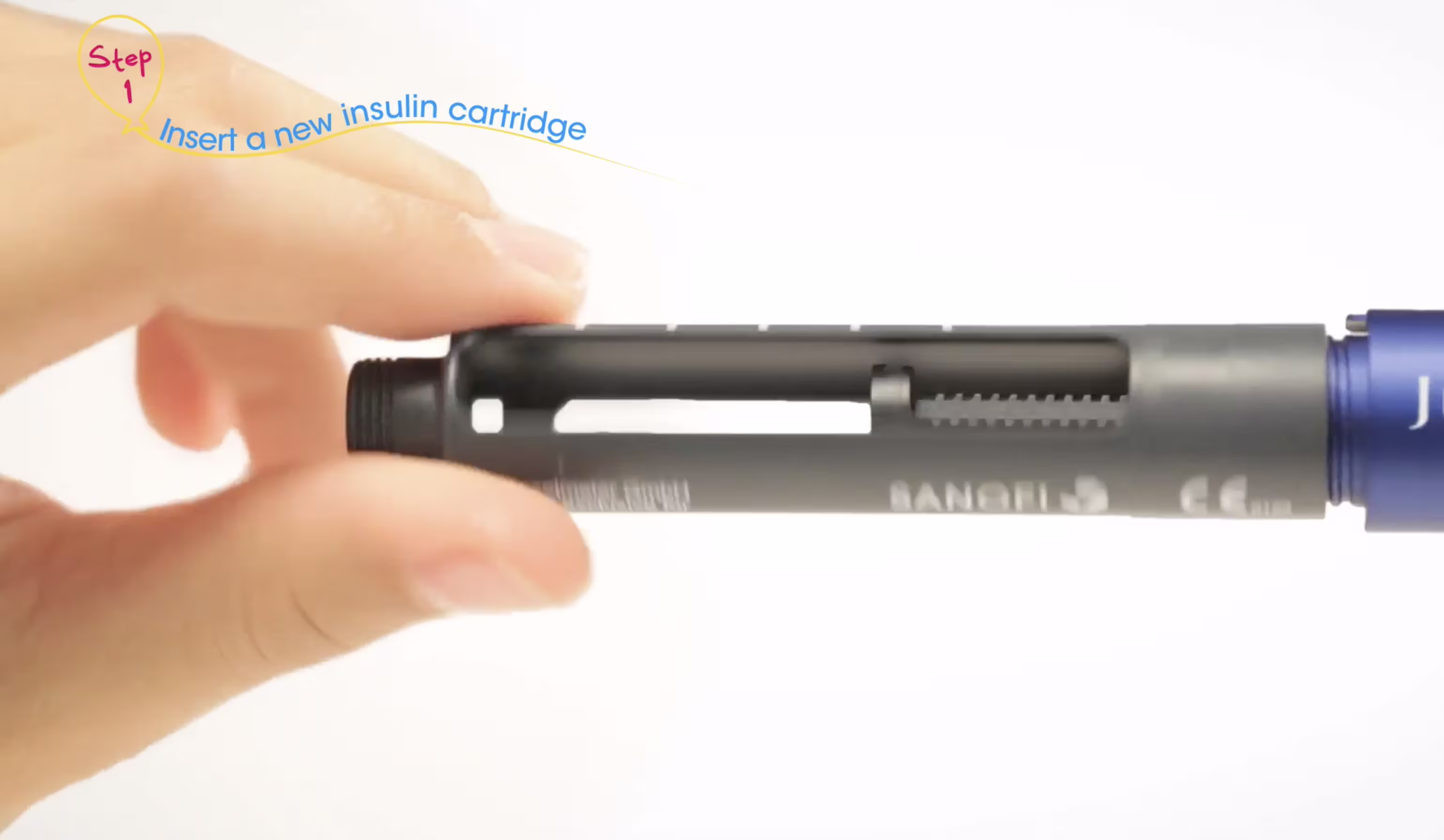 Close-up of a hand inserting an insulin cartridge into an insulin pen device.